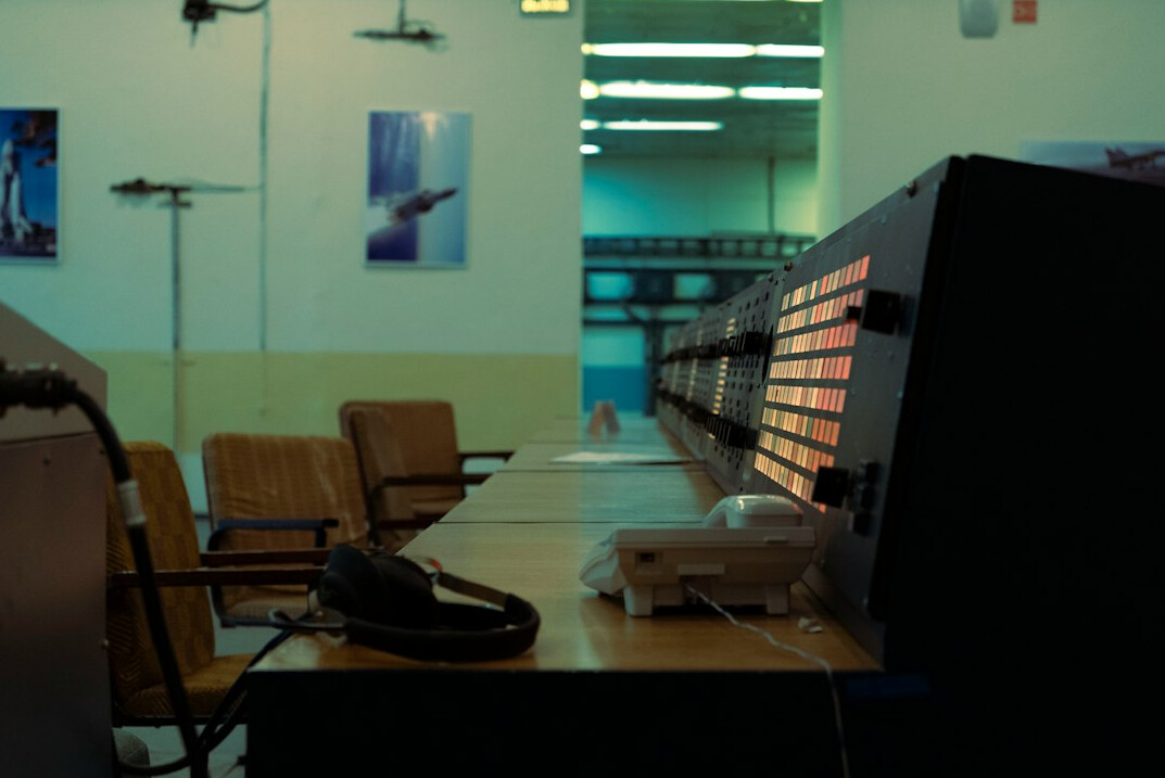 Broadcast control room with technicians monitoring live video feeds